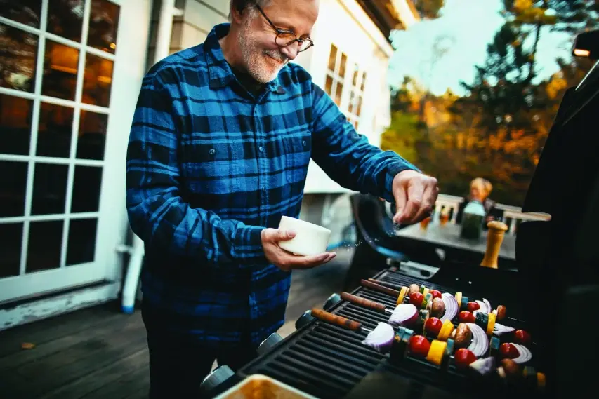 A man grilling kabobs