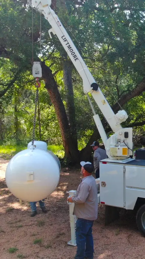 Above ground tank installation with crane